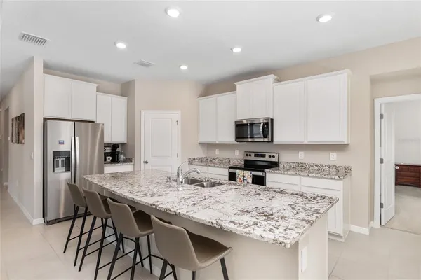 a dining room with a table and chairs