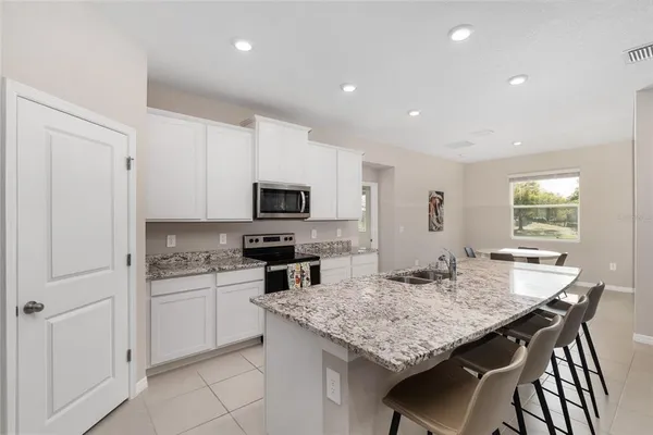 a view of a dining room with furniture window and outside view