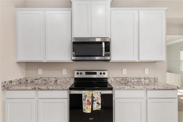 a large white bed in a white room