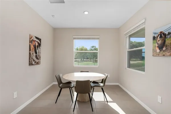 a spacious bathroom with a tub sink shower and mirror