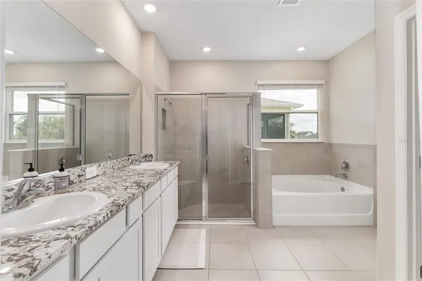 a bathroom with a shower and a tub