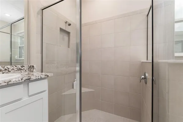 a view of a hallway with wooden shelves