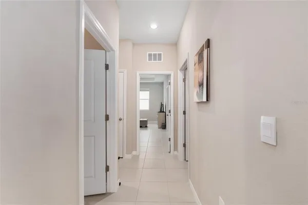 a bathroom with a granite countertop toilet sink and mirror