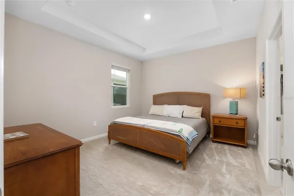 a white bath tub sitting next to a white toilet and sink