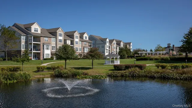 a view of a water pond with green space