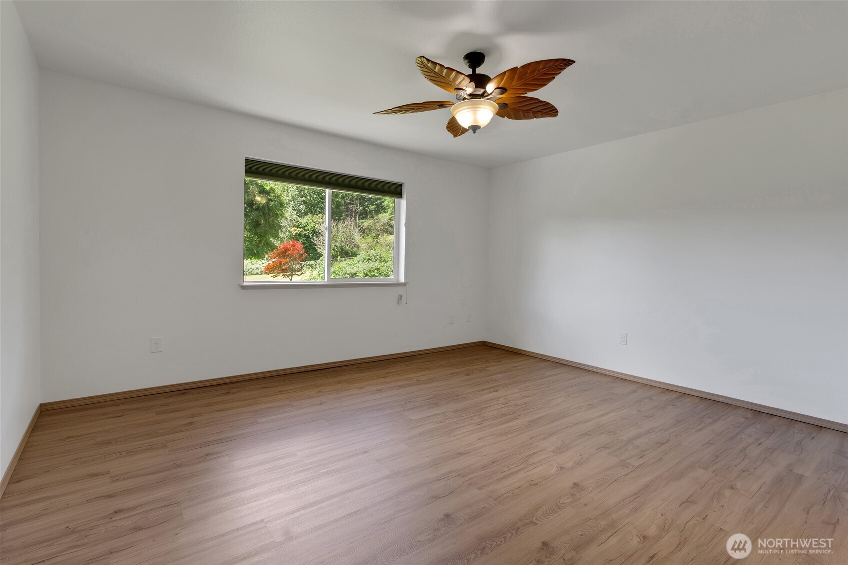 1450 Southeast Spruce Road Port Orchard, WA 98367 - Photo 17 of 39 wooden floor in an empty room with a window