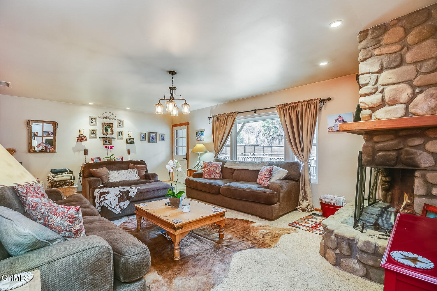 9972 Creek Road Oak View, CA 93022 - Photo 11 of 50 a living room with furniture and a chandelier