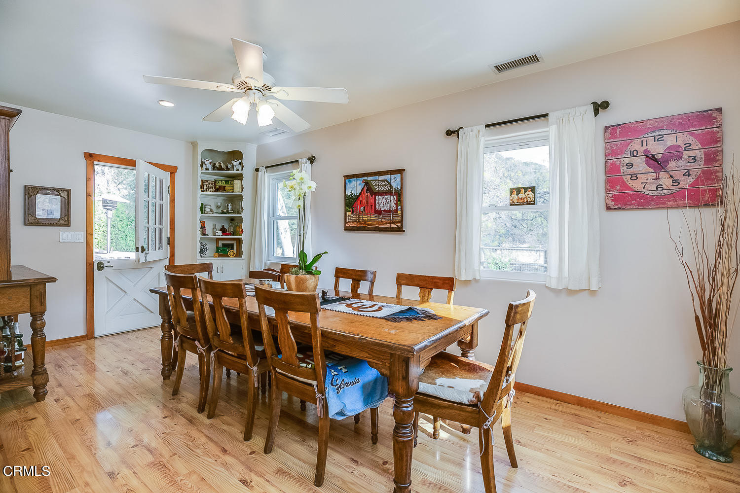 9972 Creek Road Oak View, CA 93022 - Photo 13 of 50 a view of a dining room with furniture window and wooden floor