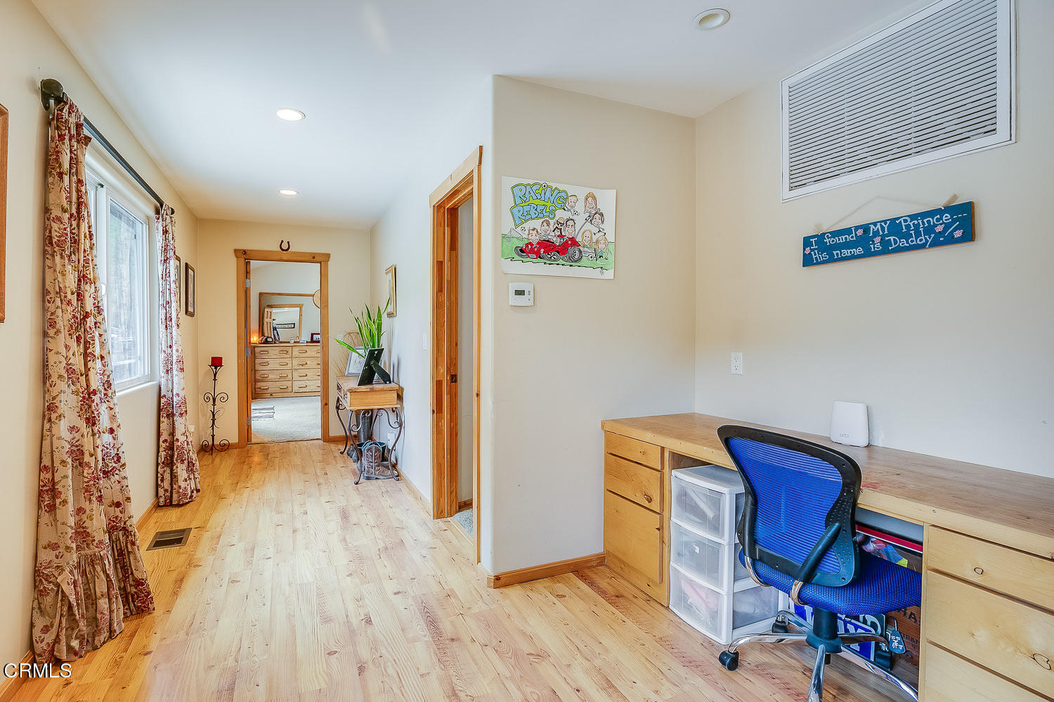9972 Creek Road Oak View, CA 93022 - Photo 20 of 50 a view of a hallway with workspace and wooden floor