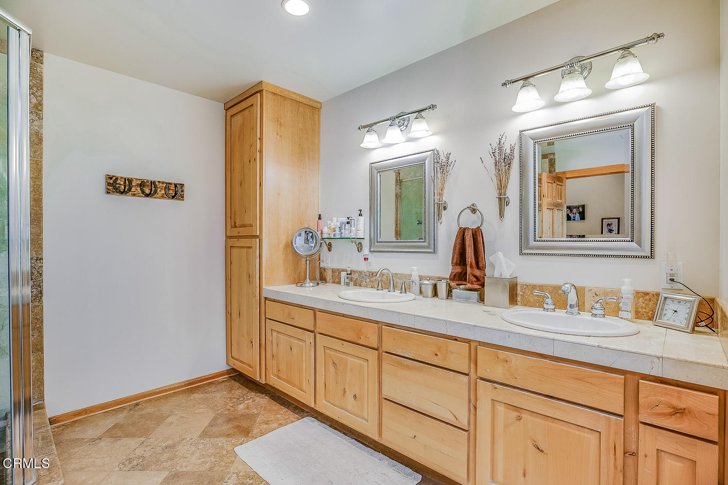 9972 Creek Road Oak View, CA 93022 - Photo 29 of 50 a bathroom with a double vanity sink and a mirror