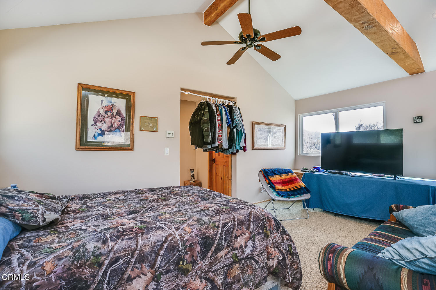 9972 Creek Road Oak View, CA 93022 - Photo 33 of 50 a bedroom with a bed and a flat screen tv