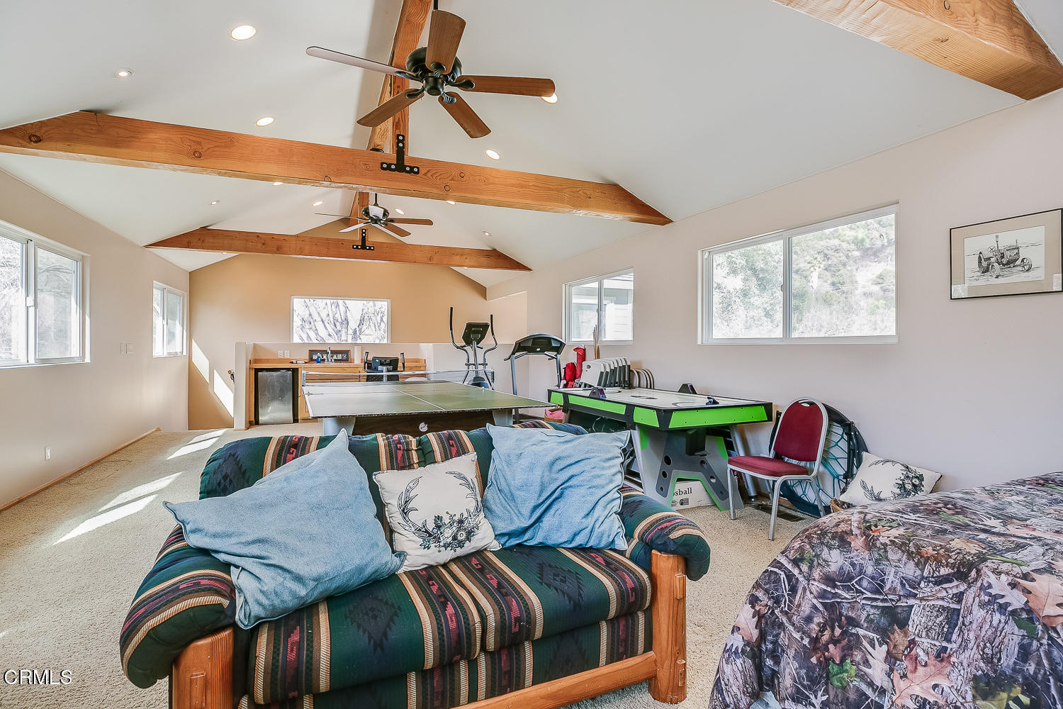 9972 Creek Road Oak View, CA 93022 - Photo 34 of 50 a living room with furniture a rug and a chandelier
