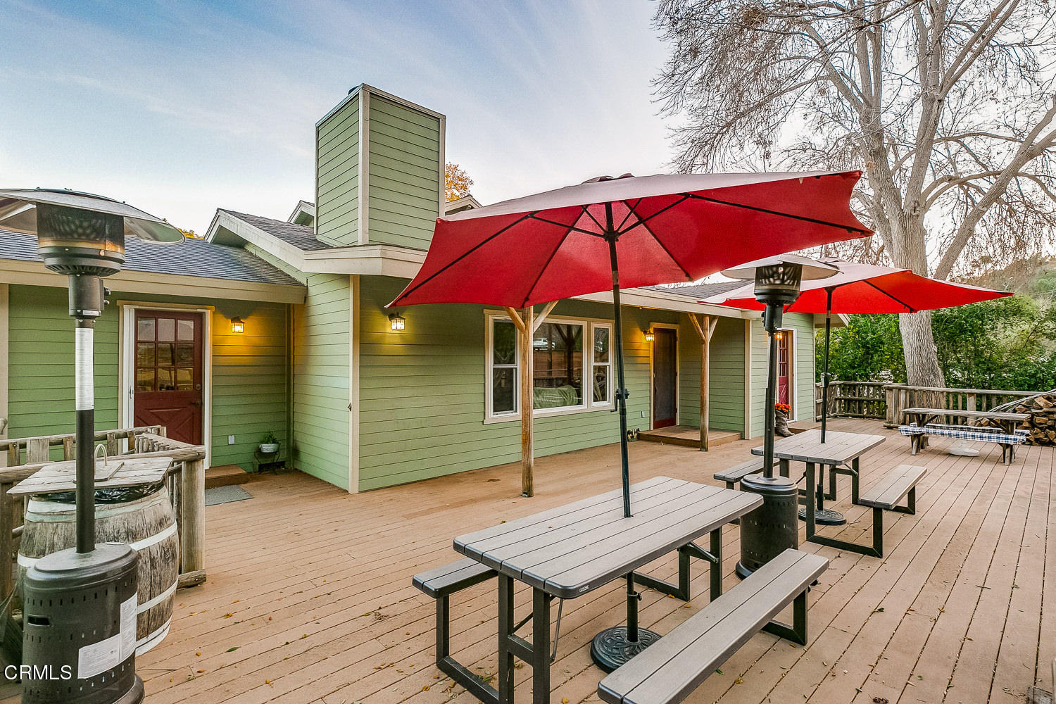 9972 Creek Road Oak View, CA 93022 - Photo 38 of 50 a patio with a table and chairs under an umbrella