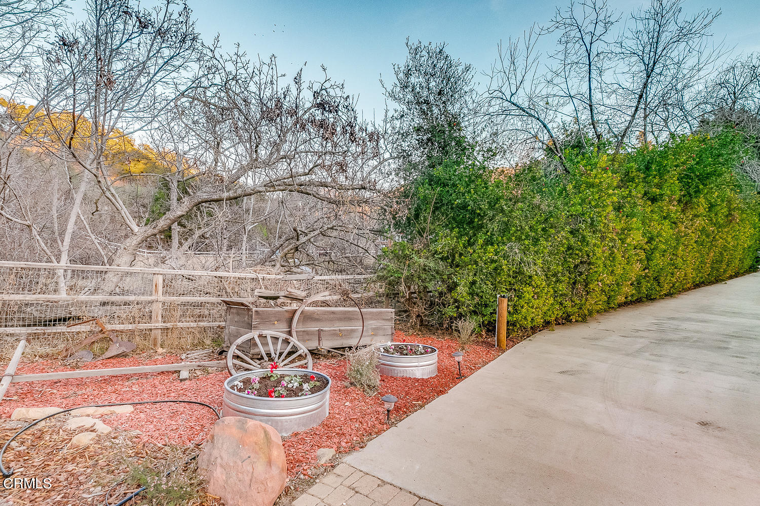 9972 Creek Road Oak View, CA 93022 - Photo 44 of 50 a wooden bench sitting in backside of a house