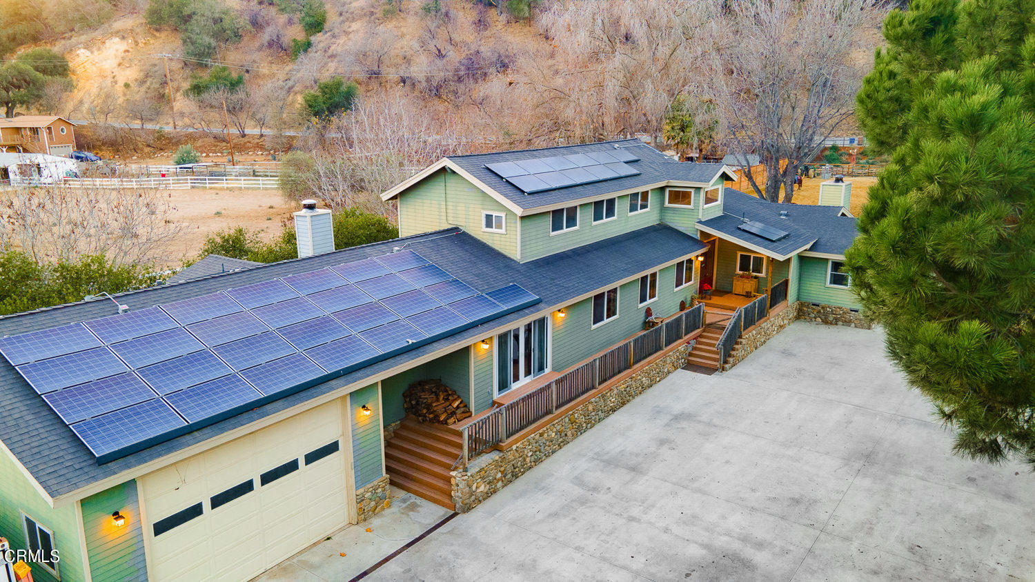 9972 Creek Road Oak View, CA 93022 - Photo 45 of 50 a balcony with outdoor seating and wooden floor