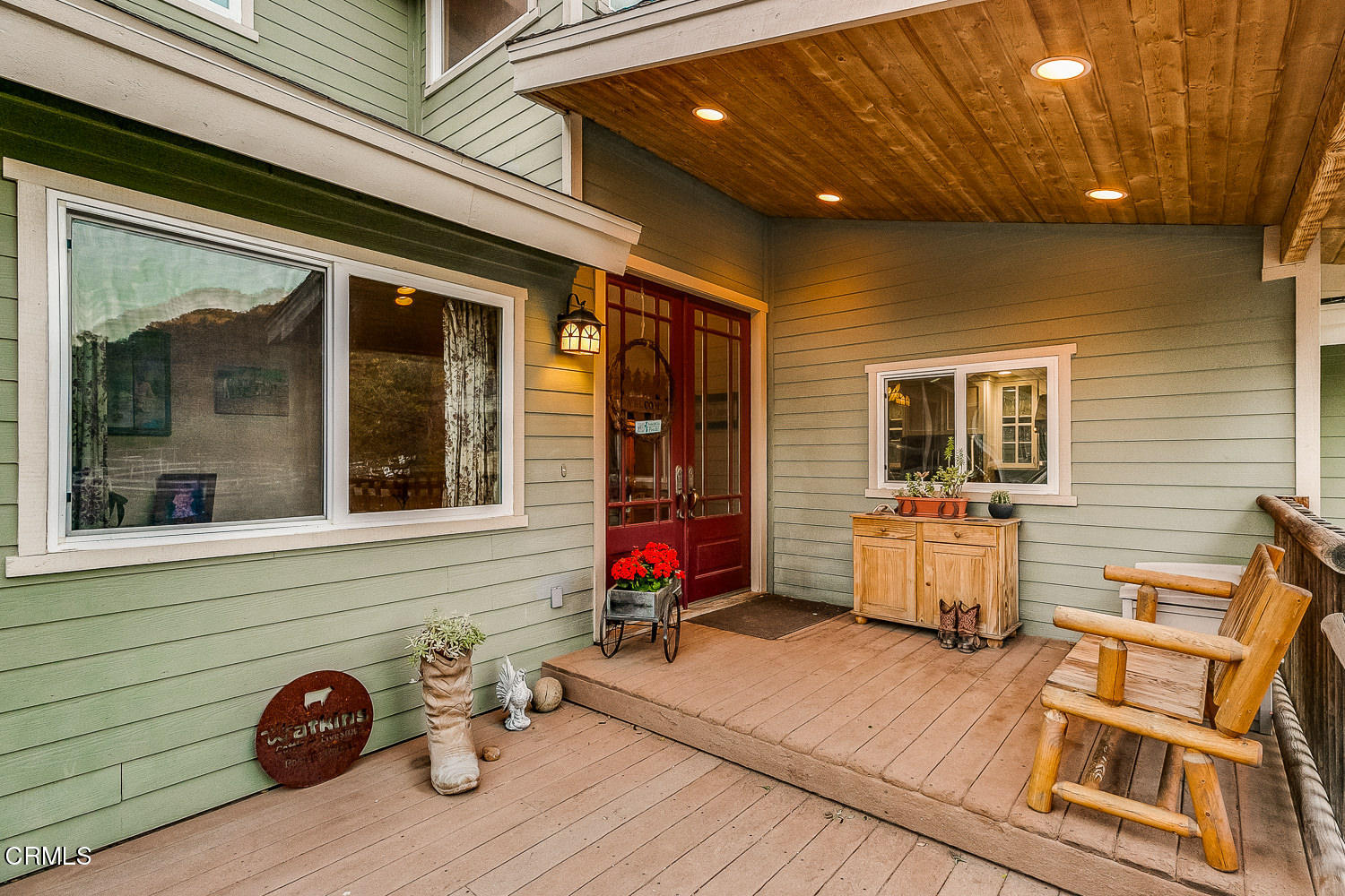 9972 Creek Road Oak View, CA 93022 - Photo 8 of 50 a view of a patio with table and chairs with wooden floor