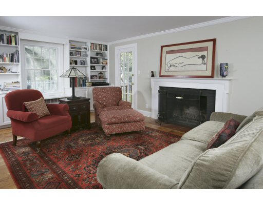15 Pheasant Road Newton, MA 02460 - Photo 1 of 7 a living room with furniture and a fireplace