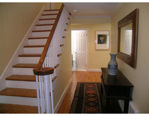 15 Pheasant Road Newton, MA 02460 - Photo 3 of 7 a view of entryway and hall with wooden floor