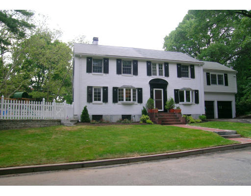15 Pheasant Road Newton, MA 02460 - Photo 4 of 7 a front view of a house with a garden