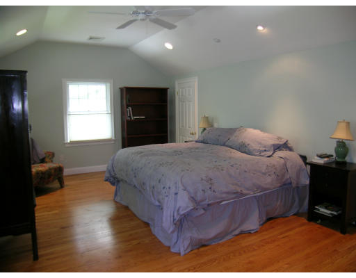 15 Pheasant Road Newton, MA 02460 - Photo 5 of 7 a bedroom with a bed and wooden floor