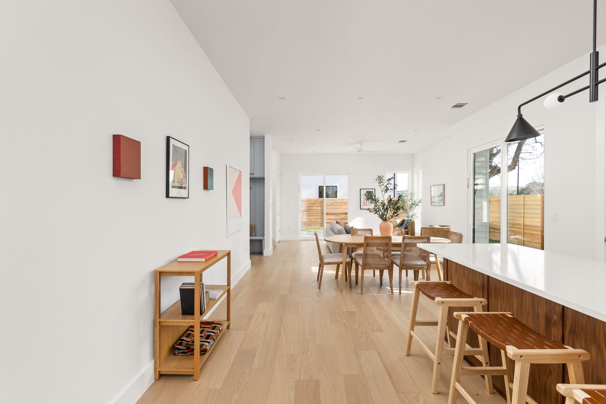 2910 East 4th Street Austin, TX 78702 - Photo 11 of 39 a dining room with furniture wooden floor and a rug