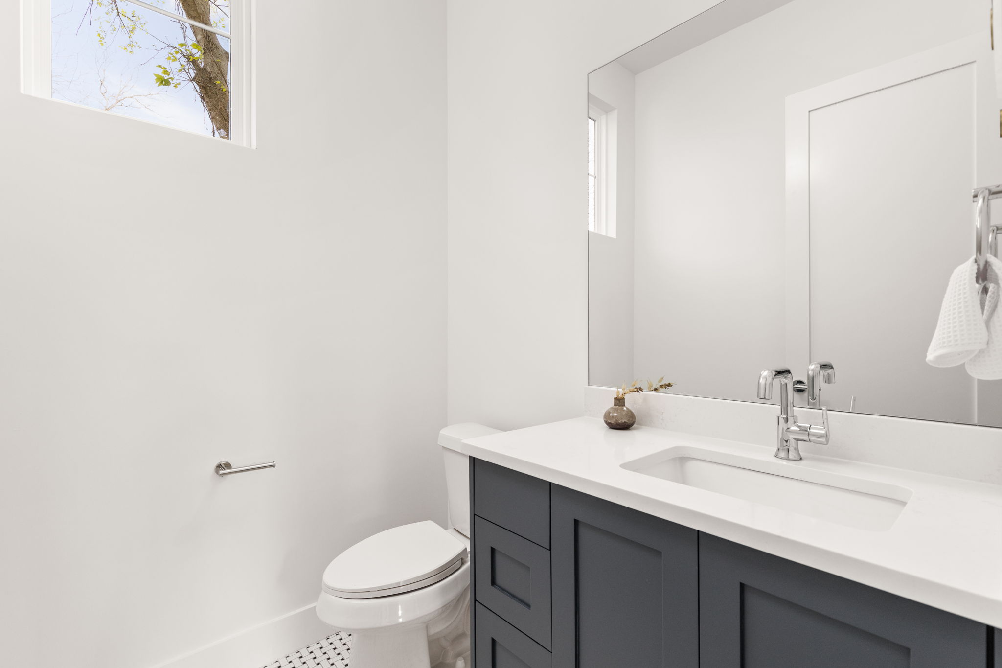2910 East 4th Street Austin, TX 78702 - Photo 19 of 39 a bathroom with a sink a toilet and a mirror