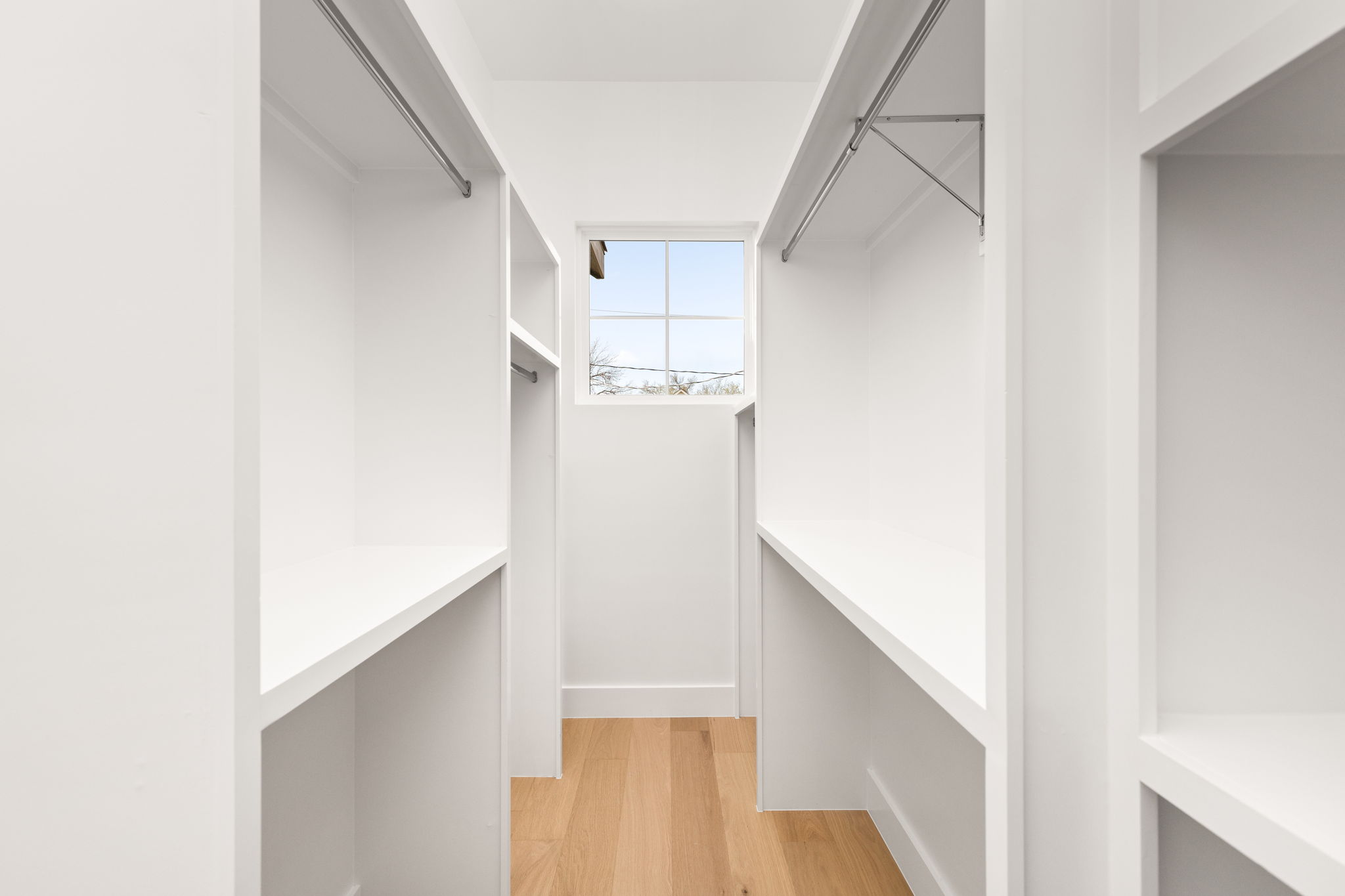 2910 East 4th Street Austin, TX 78702 - Photo 25 of 39 a view of a hallway with white walls and stairs