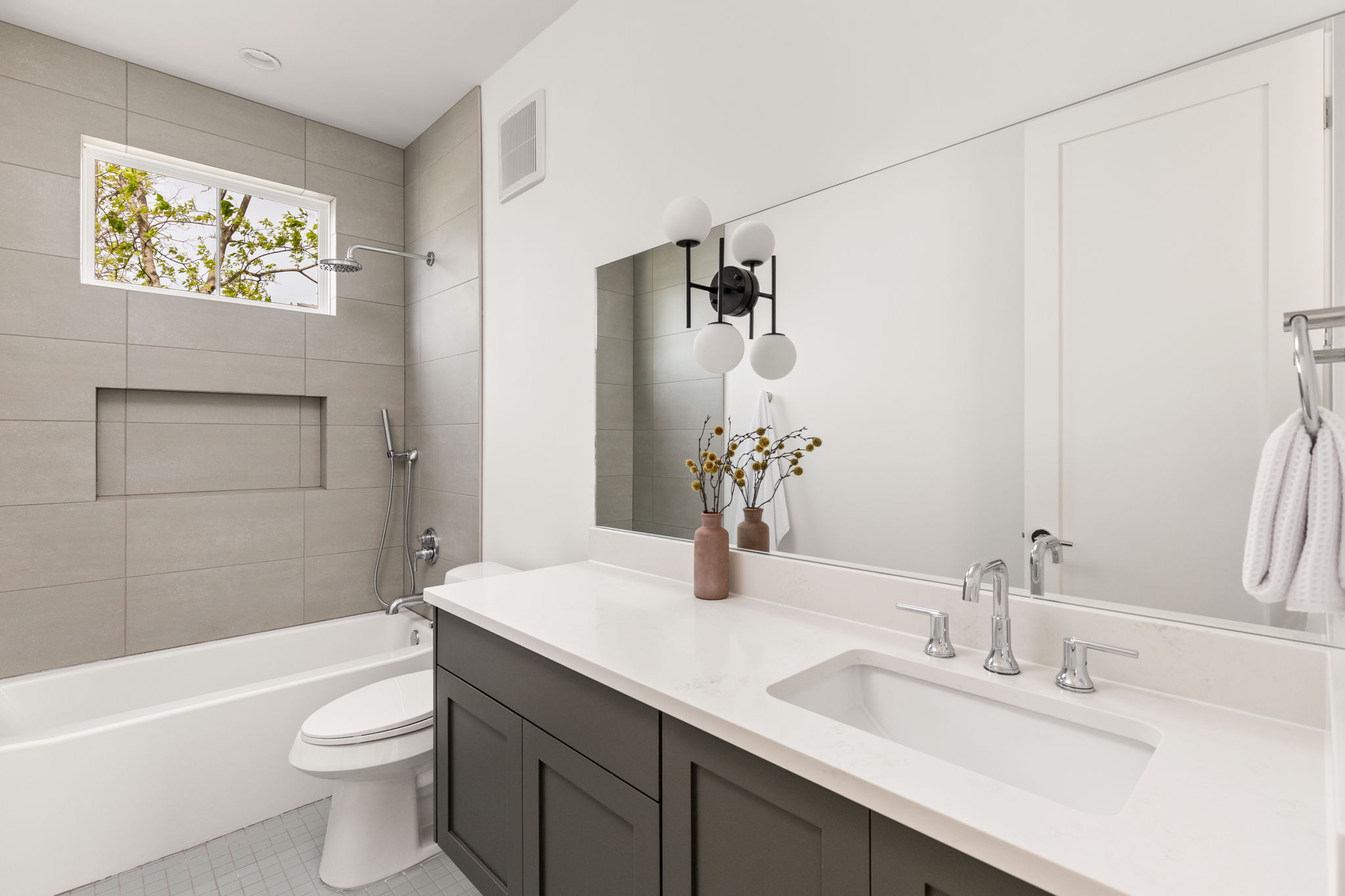 2910 East 4th Street Austin, TX 78702 - Photo 28 of 39 a bathroom with a sink a toilet and shower