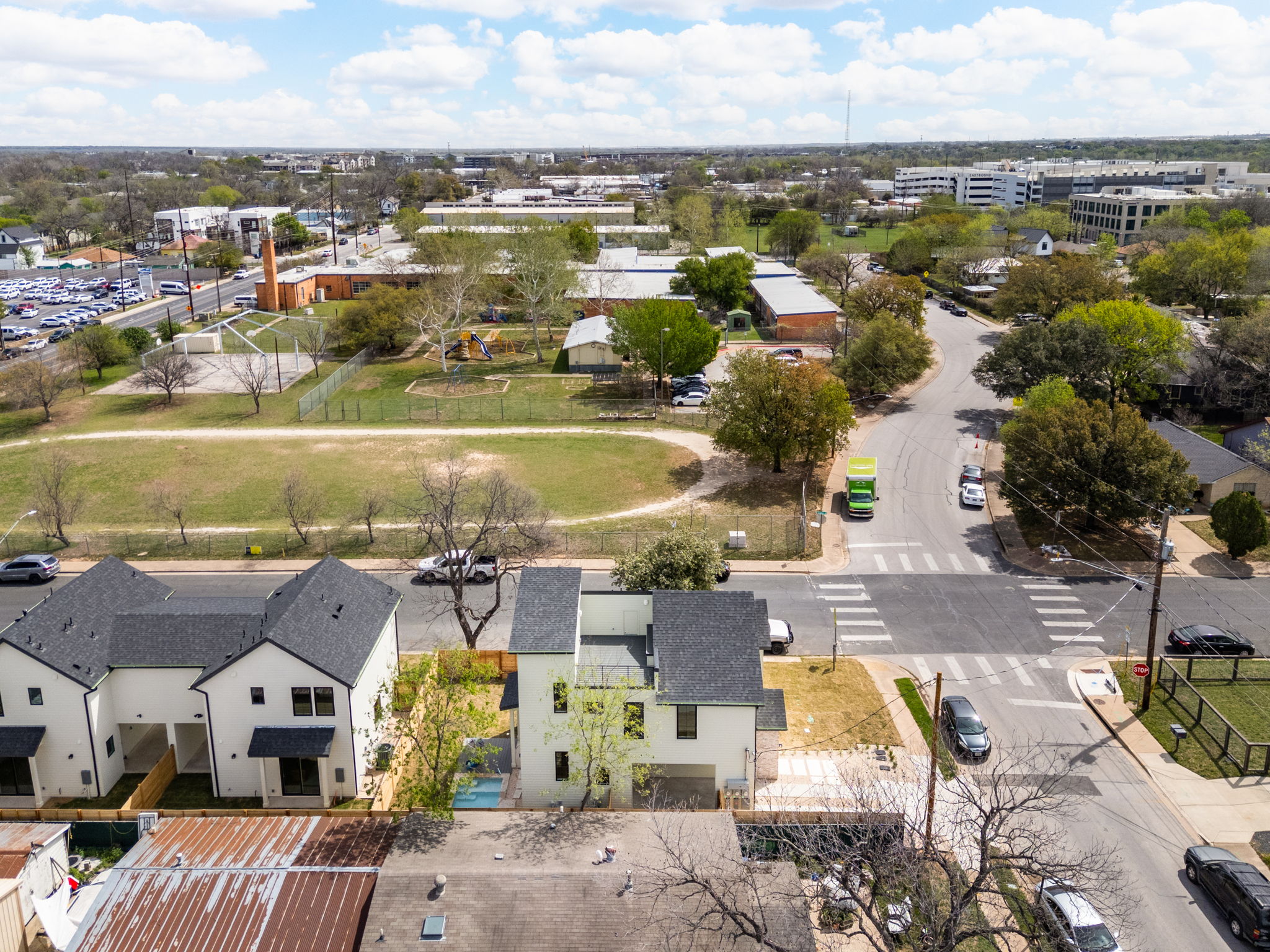 2910 East 4th Street Austin, TX 78702 - Photo 38 of 39 an aerial view of residential houses with outdoor space and swimming pool