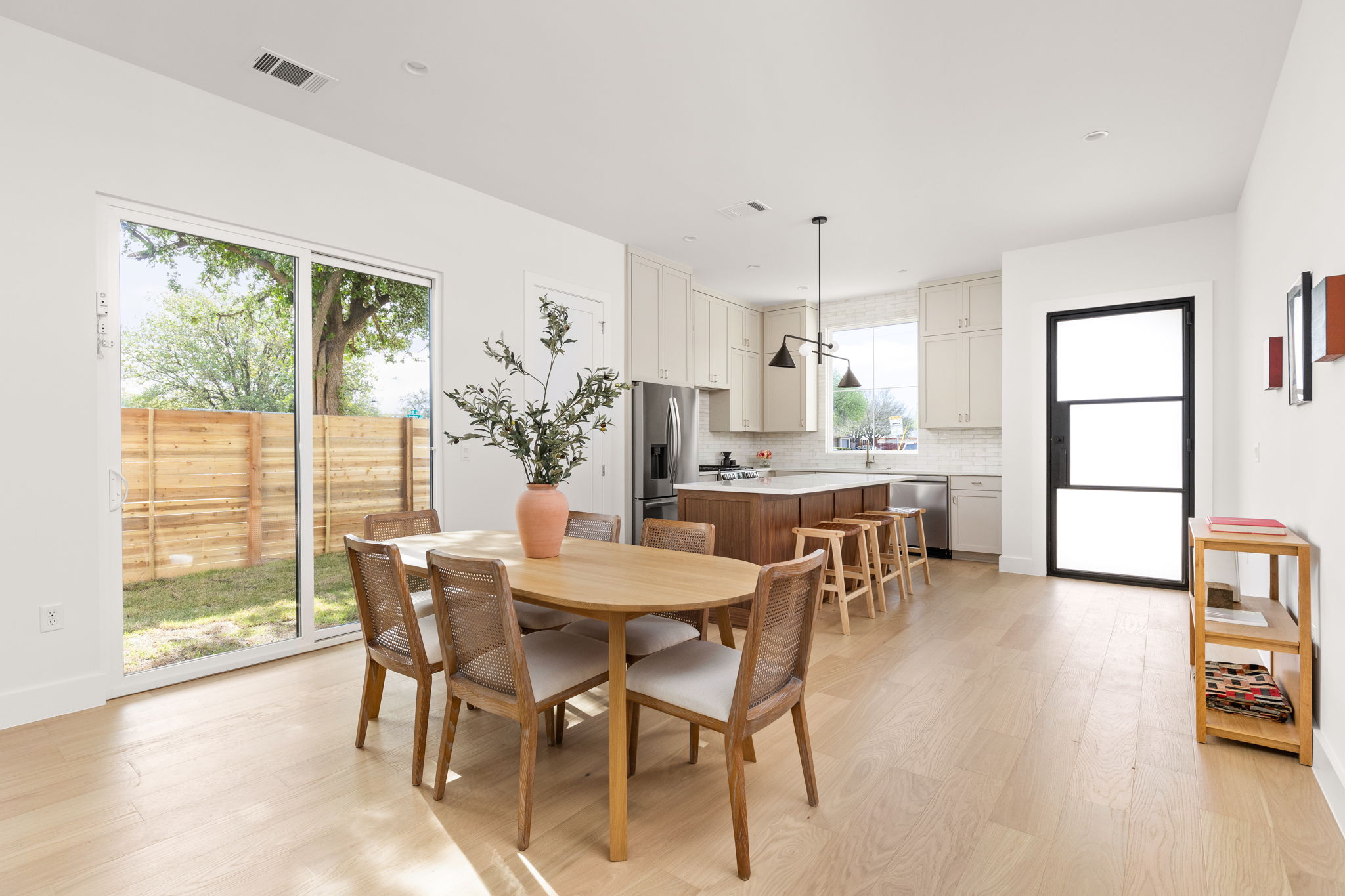 2910 East 4th Street Austin, TX 78702 - Photo 8 of 39 a view of a dining room with furniture and a window