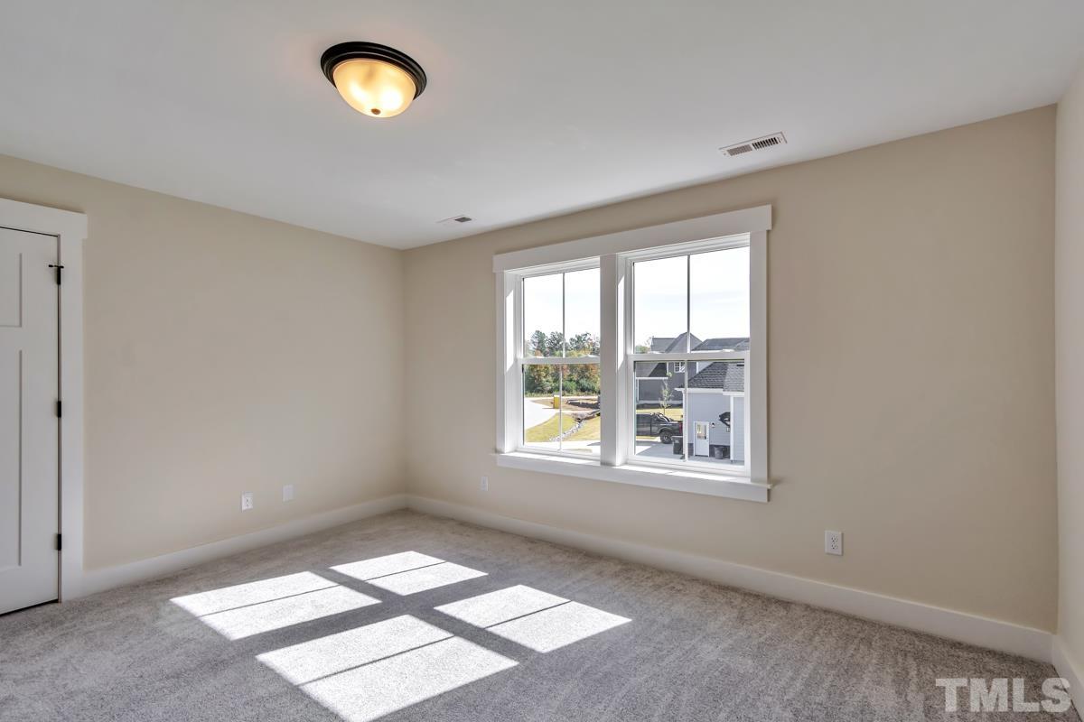 6409 Camellia Creek Drive Raleigh, NC 27603 - Photo 13 of 30 a view of an empty room with a window