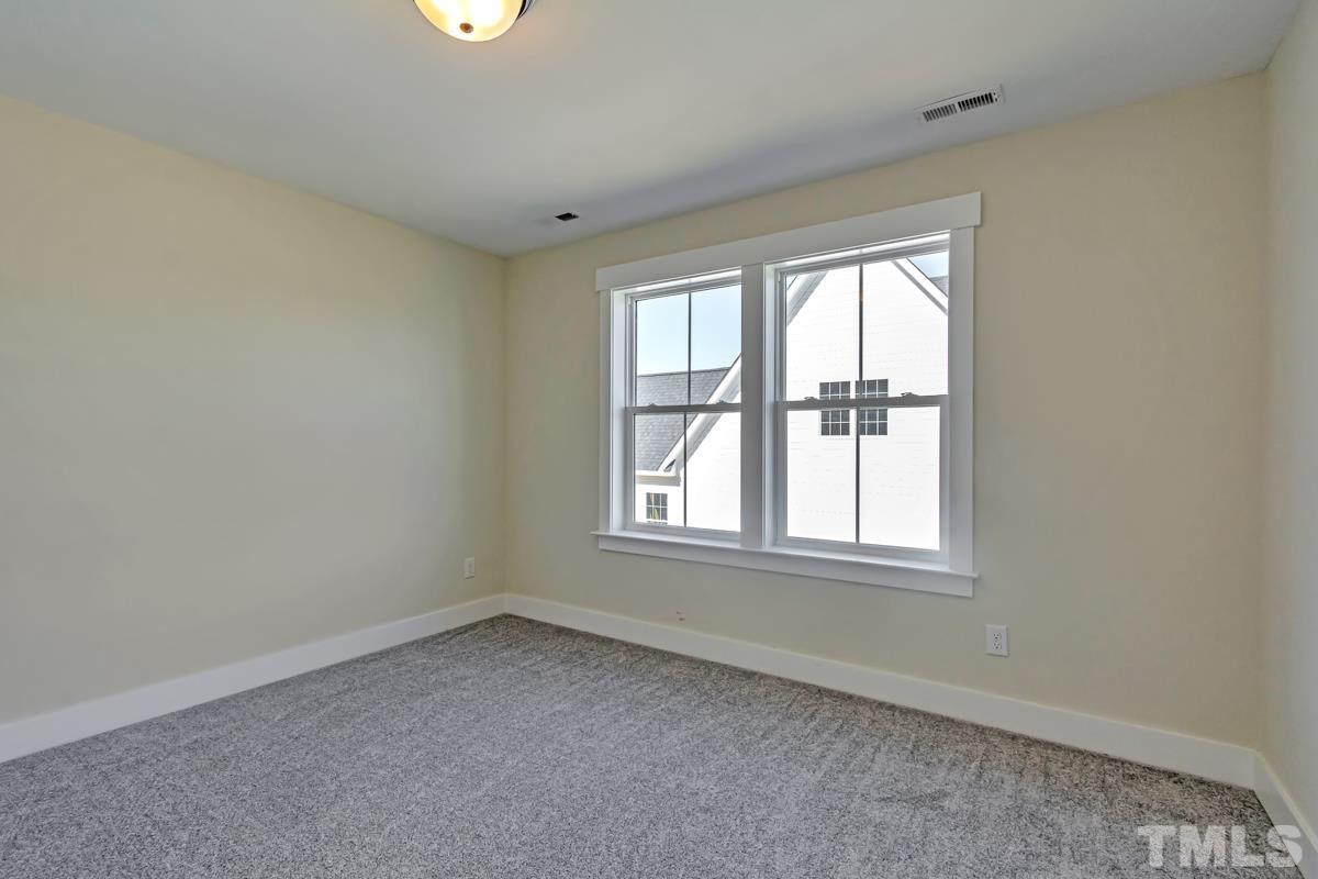 6409 Camellia Creek Drive Raleigh, NC 27603 - Photo 14 of 30 an empty room with a window