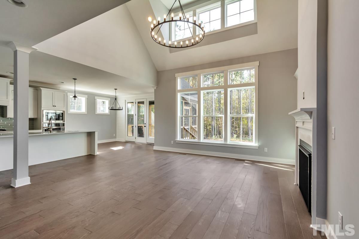 6409 Camellia Creek Drive Raleigh, NC 27603 - Photo 18 of 30 a view of an empty room with wooden floor and a window
