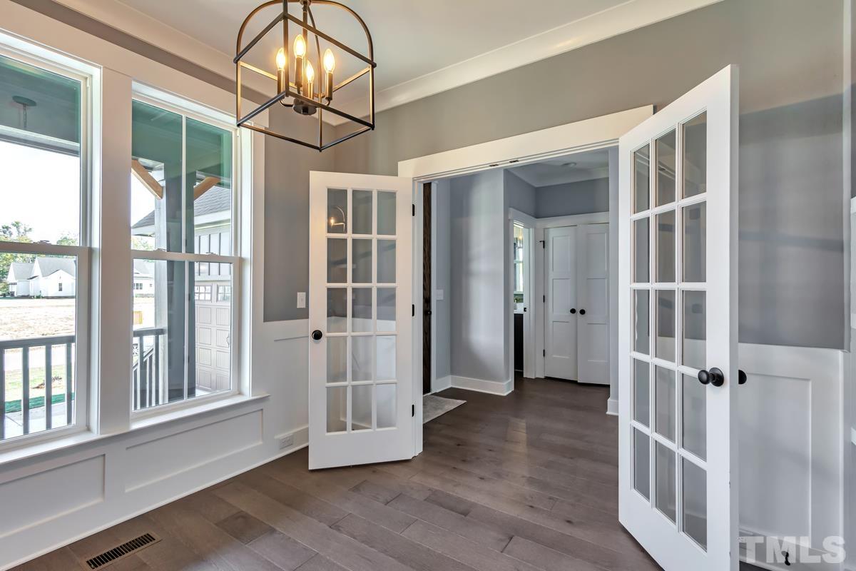 6409 Camellia Creek Drive Raleigh, NC 27603 - Photo 29 of 30 wooden floor in an empty room with a window