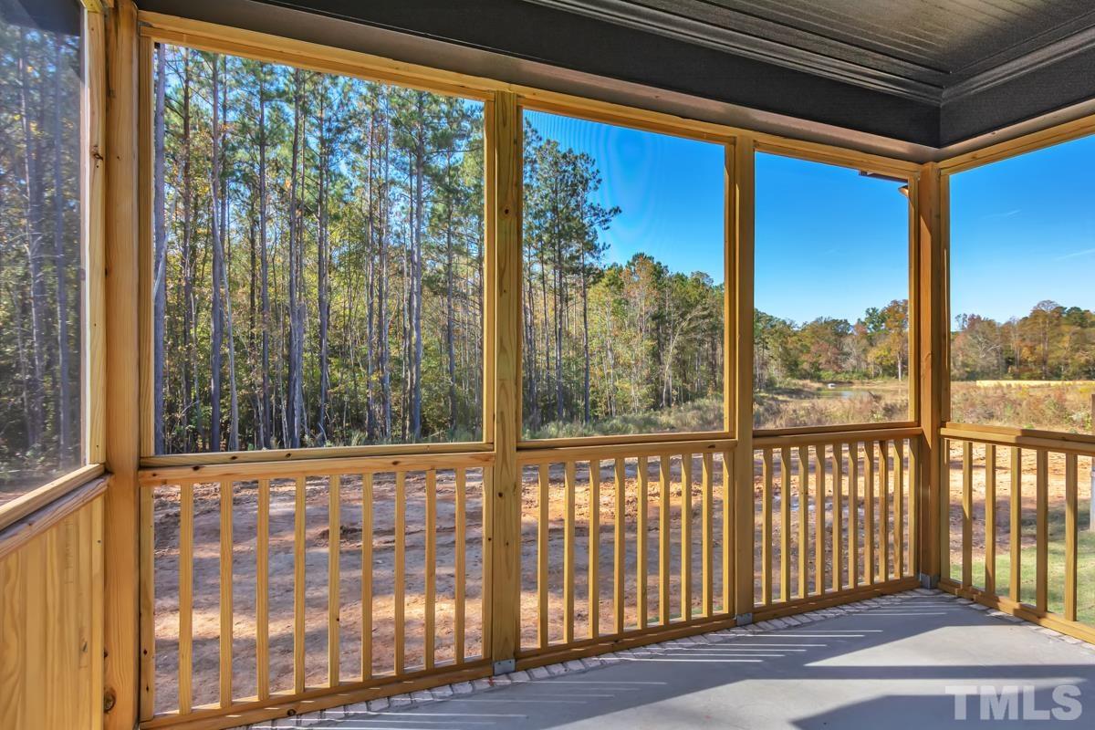 6409 Camellia Creek Drive Raleigh, NC 27603 - Photo 8 of 30 a view of a porch with a floor to ceiling window