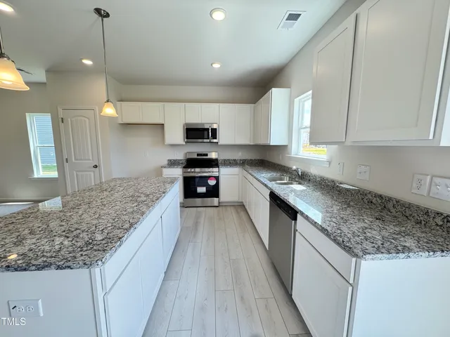 a bedroom with a bed and furniture