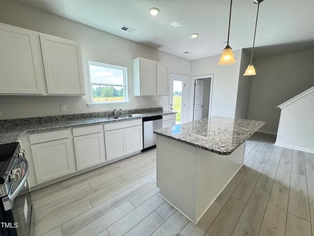a bathroom with a double vanity sink and a shower