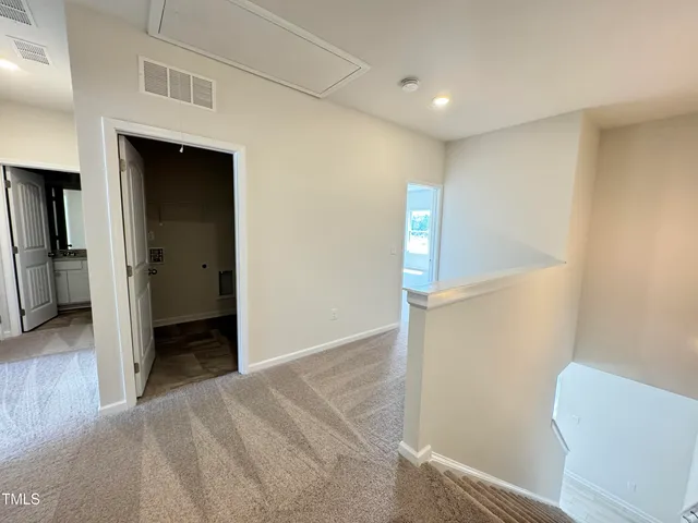 a room with furniture and white walls