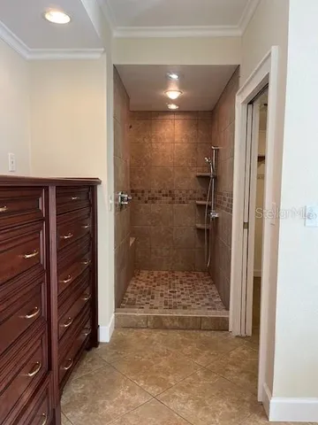 a bathroom with a granite countertop sink and shower