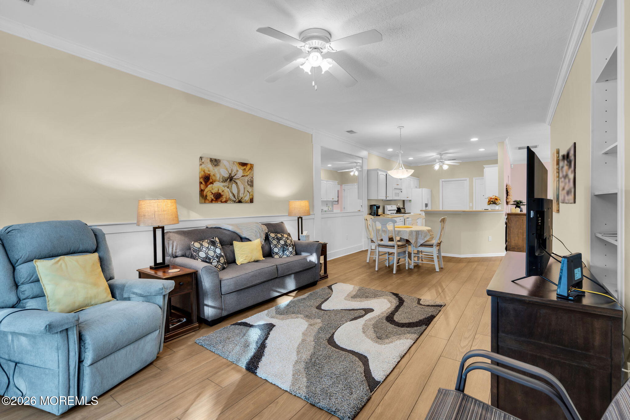 104 Silverlawns Drive Lakewood, NJ 08701 - Photo 13 of 36 a living room with furniture and a chandelier
