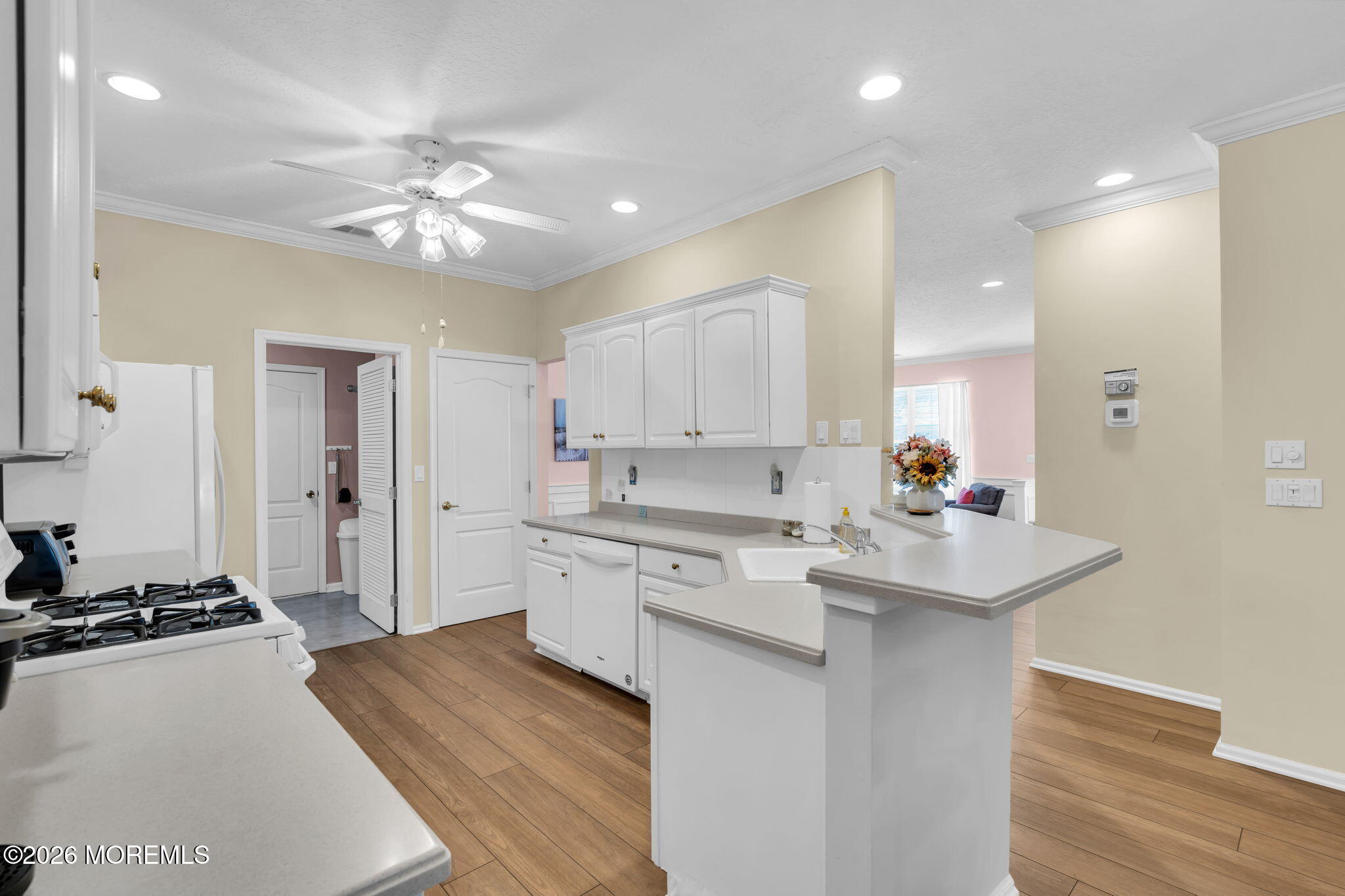 104 Silverlawns Drive Lakewood, NJ 08701 - Photo 16 of 36 a kitchen with a sink stove and refrigerator