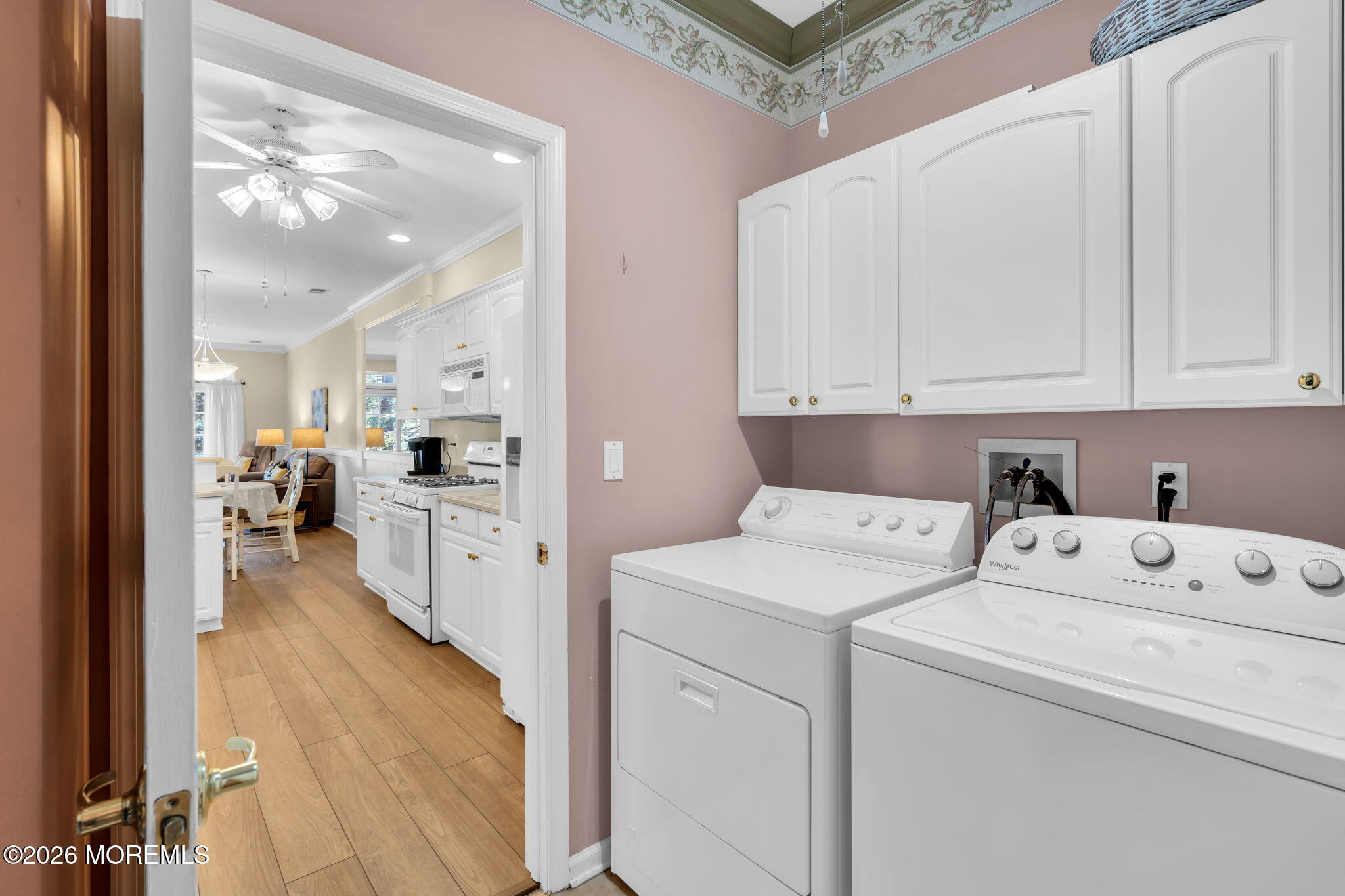104 Silverlawns Drive Lakewood, NJ 08701 - Photo 19 of 36 a view of washer and dryer with kitchen in the background