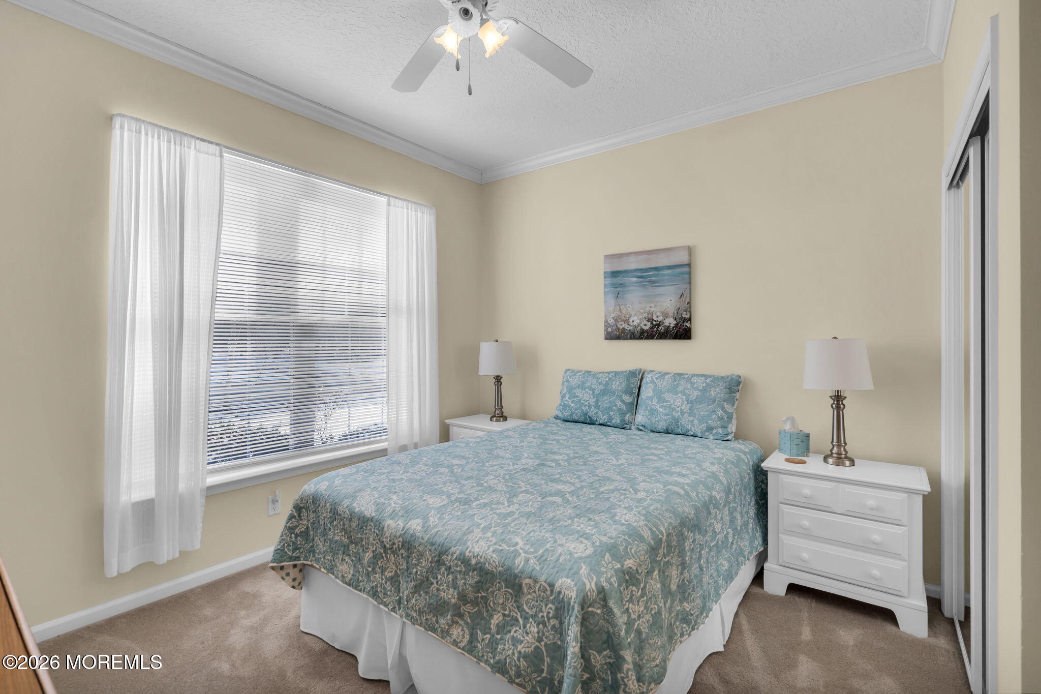 104 Silverlawns Drive Lakewood, NJ 08701 - Photo 22 of 36 a bedroom with a large bed and a window