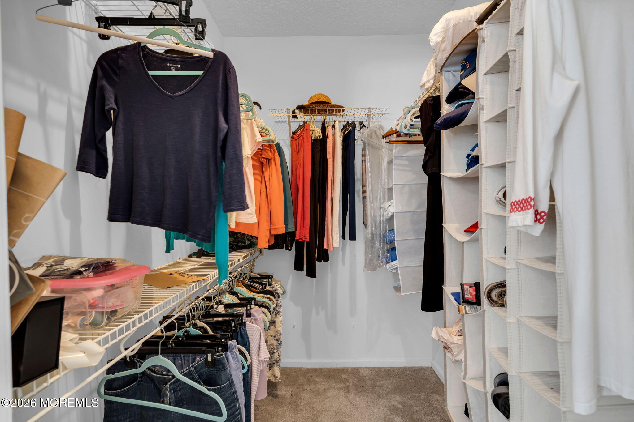 104 Silverlawns Drive Lakewood, NJ 08701 - Photo 28 of 36 a view of walk in closet with clothes and shoes