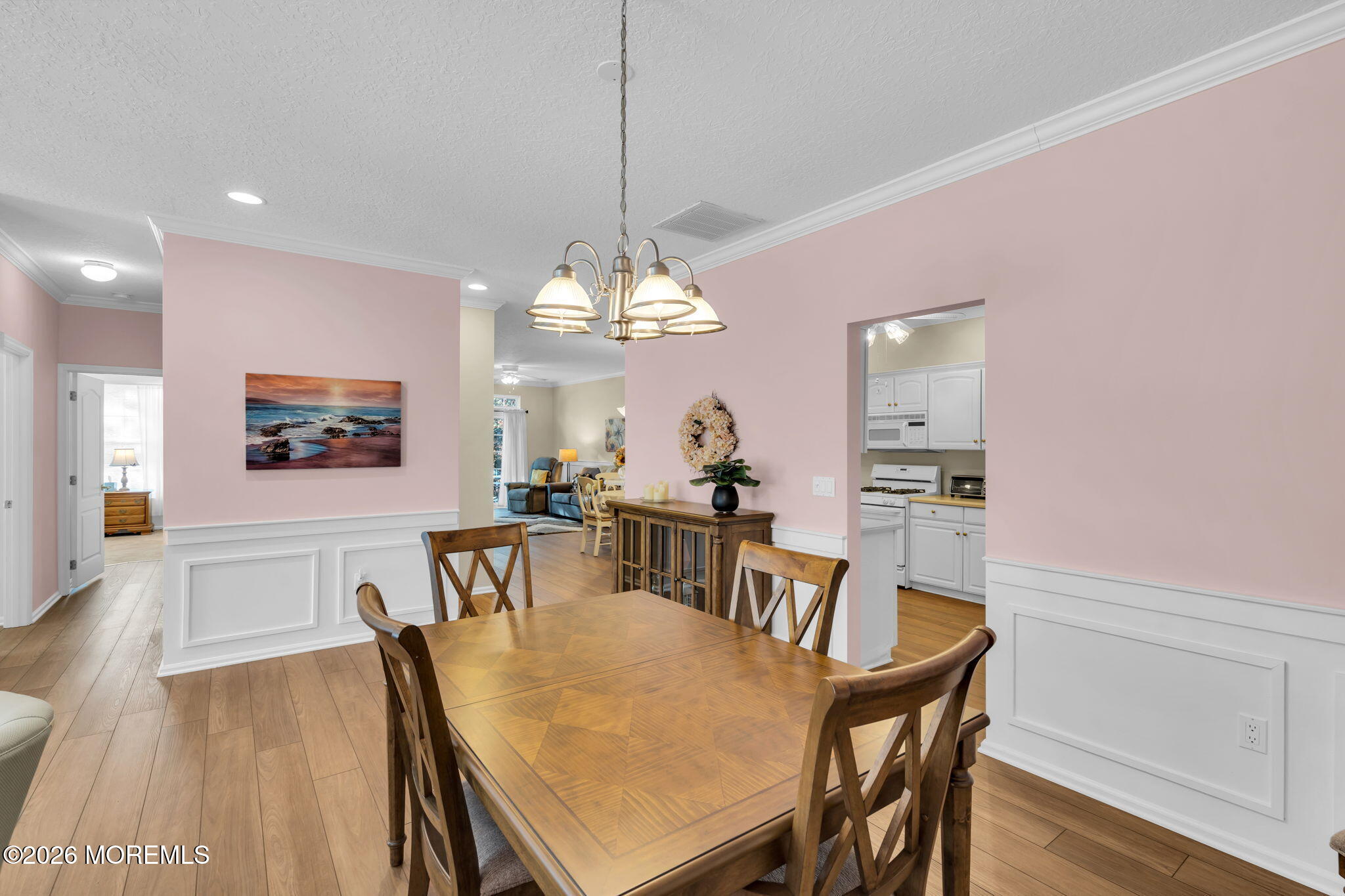 104 Silverlawns Drive Lakewood, NJ 08701 - Photo 8 of 36 a view of a dining room with furniture a chandelier and wooden floor