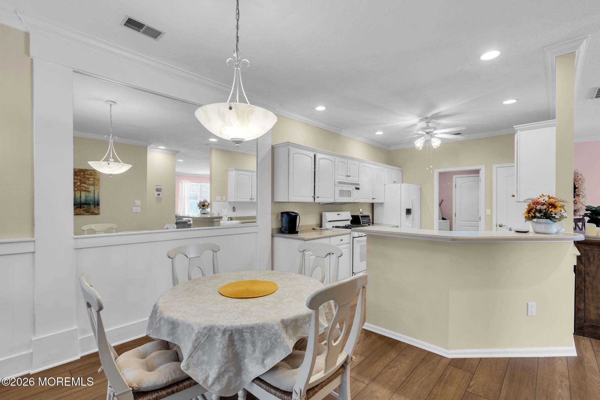 104 Silverlawns Drive Lakewood, NJ 08701 - Photo 10 of 36 a kitchen with stainless steel appliances granite countertop a kitchen island a stove a table and chairs in it