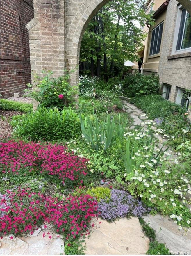 1965 Jasmine Street Denver, CO 80220 - Photo 32 of 41 a view of a garden with flowers and flowers