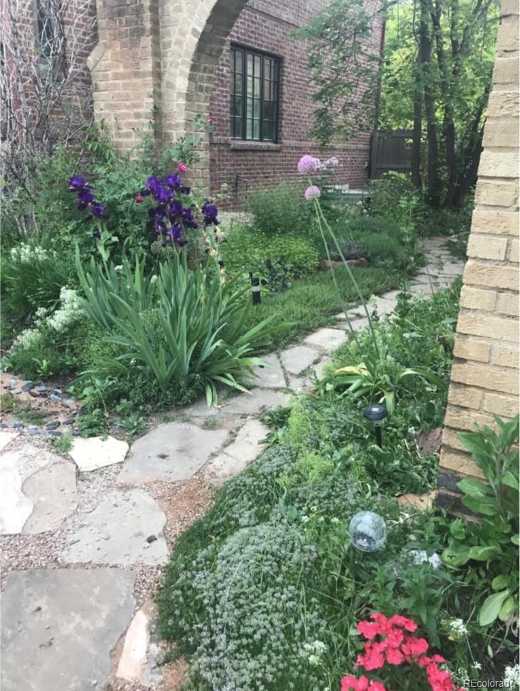 1965 Jasmine Street Denver, CO 80220 - Photo 35 of 41 a view of a flower arrangement in backyard