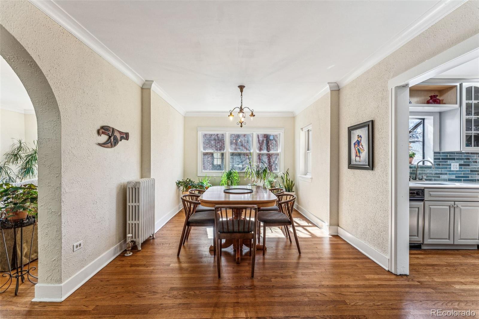 1965 Jasmine Street Denver, CO 80220 - Photo 9 of 41 a view of a dining room with furniture window and wooden floor