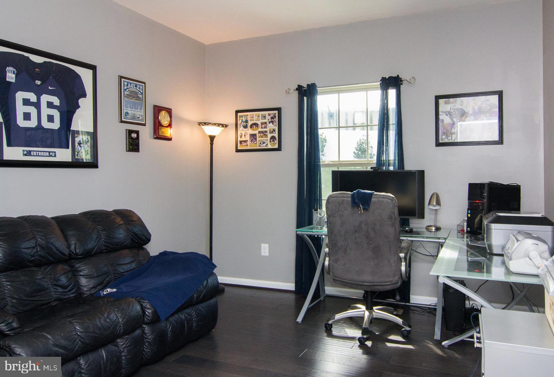 10422 Windlass Run Road Baltimore, MD 21220 - Photo 15 of 30 a livingroom with workspace and a couch